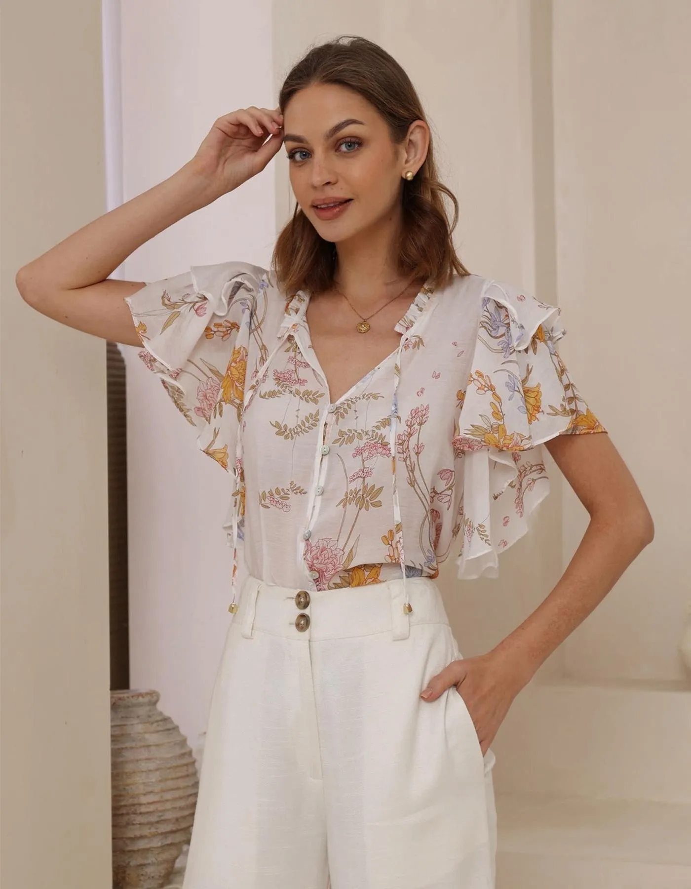 Cyrene Flutter Sleeve V Neck Top in White Floral