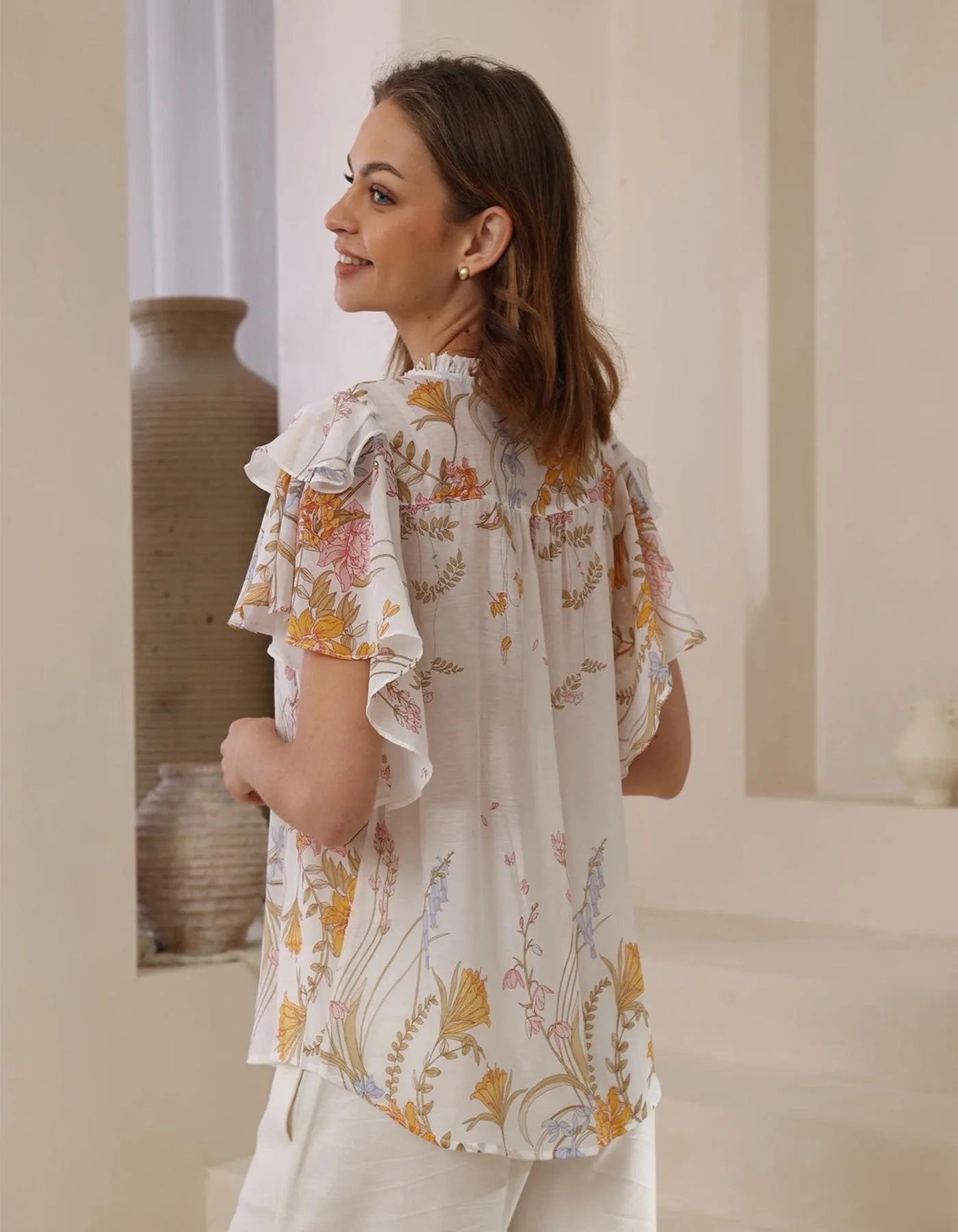 Cyrene Flutter Sleeve V Neck Top in White Floral